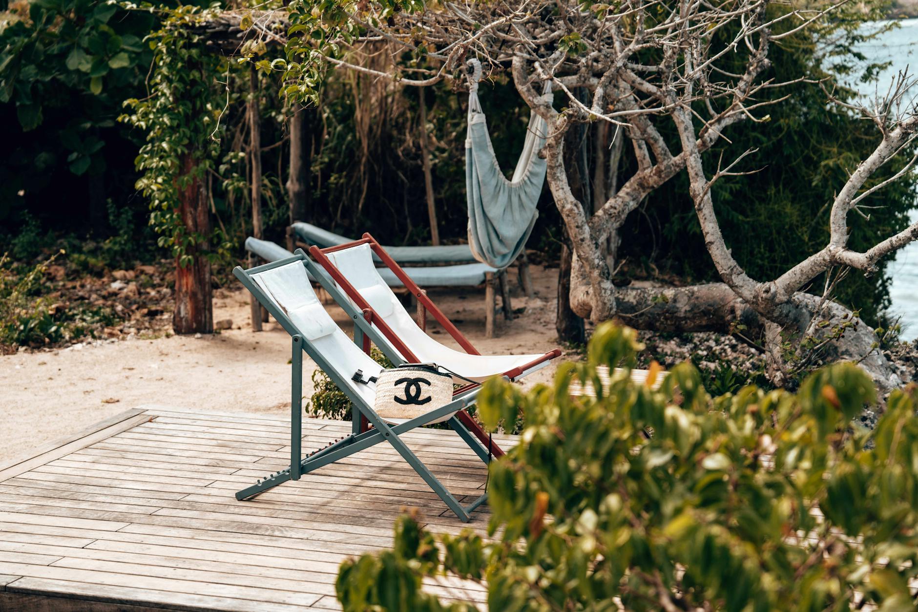 chanel bag on a deckchair in seaside